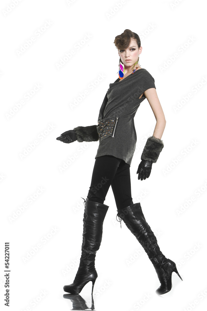 young casual man full body with gloves walking in studio young casual man full body with gloves walking in studio