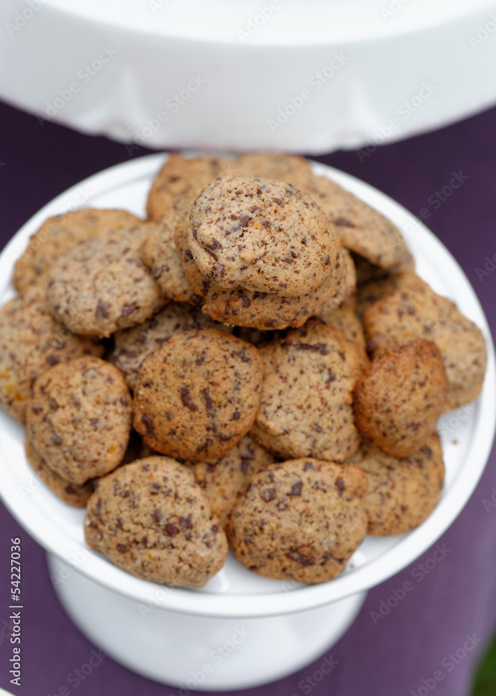 Delicious chocolate chip cookies on table