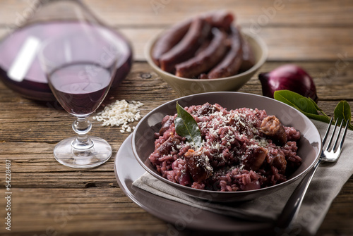 risotto with red wine and sausage, selective focus