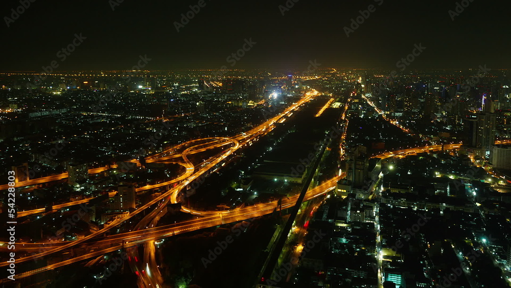Aerial view night illuminated cityscape with intersections
