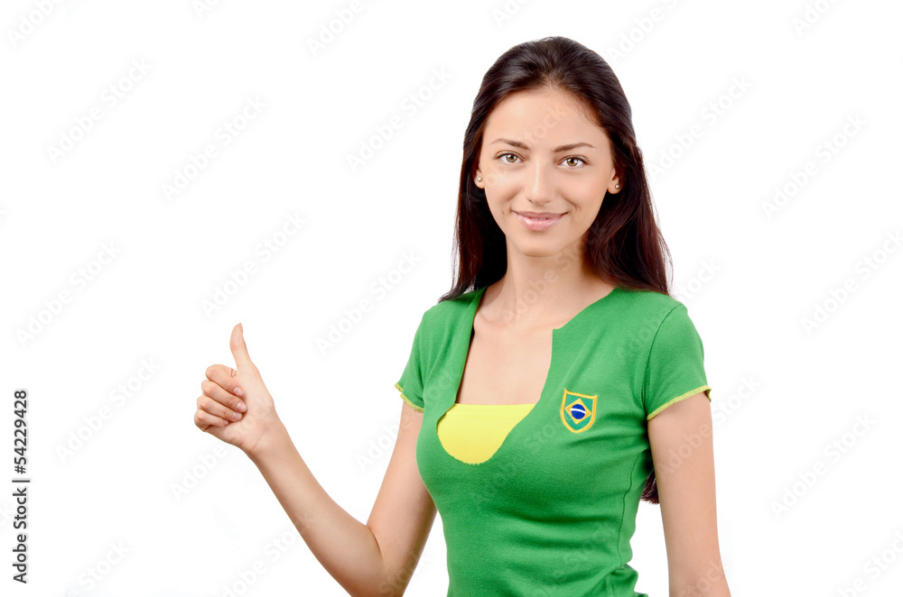 Thumbs up for Brazil.Girl with Brazilian flag on her t-shirt. Thumbs up for Brazil.Girl with Brazilian flag on her t-shirt.