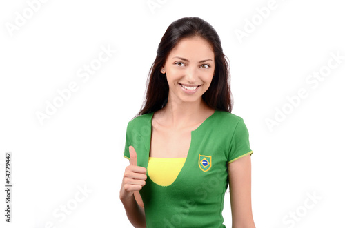 Thumbs up for Brazil.Girl with Brazilian flag on her t-shirt.