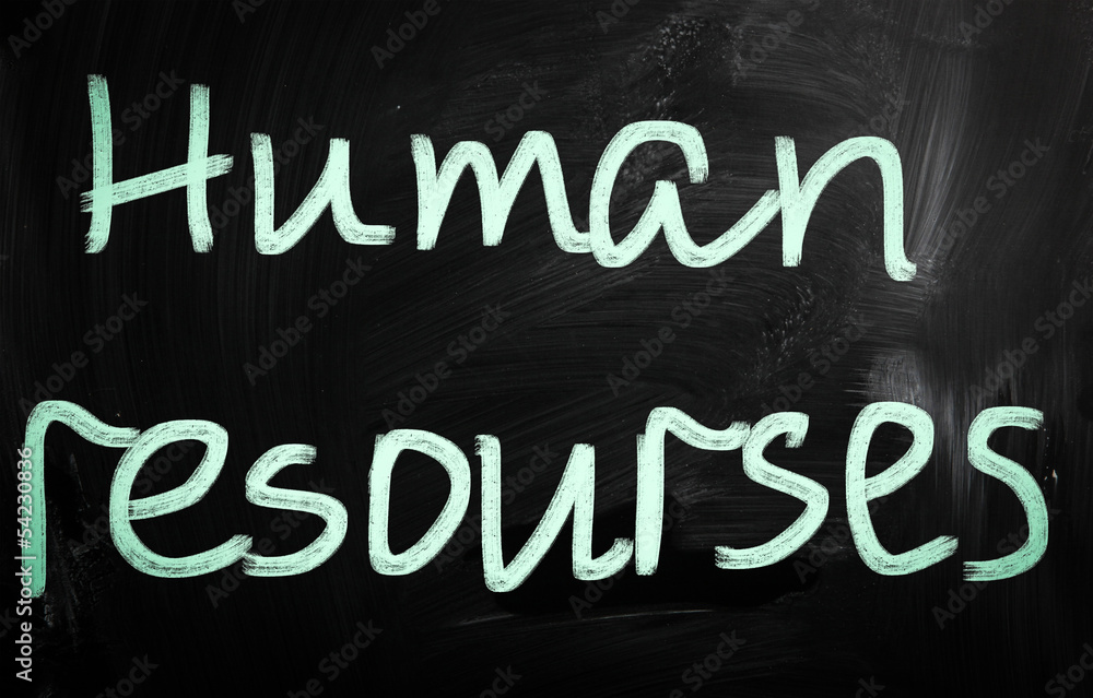 The word 'Human resources' handwritten with white chalk on a bla The word 'Human resources' handwritten with white chalk on a bla