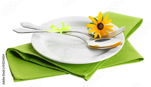 spoon, fork and flower on plate, isolated on white
