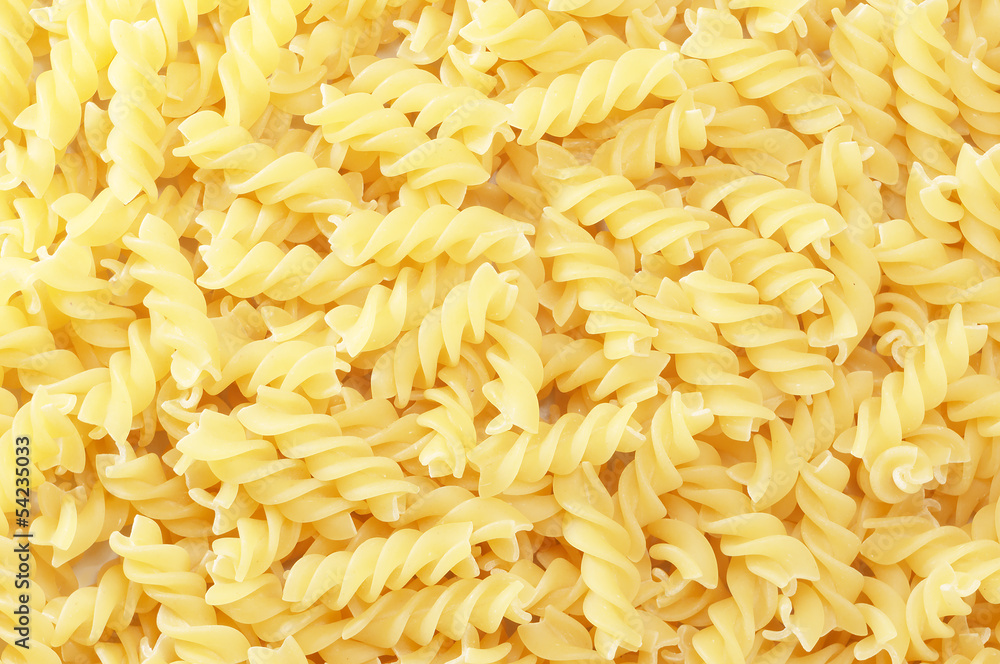 background with close up of spiral fusilli pasta background with close up of spiral fusilli pasta