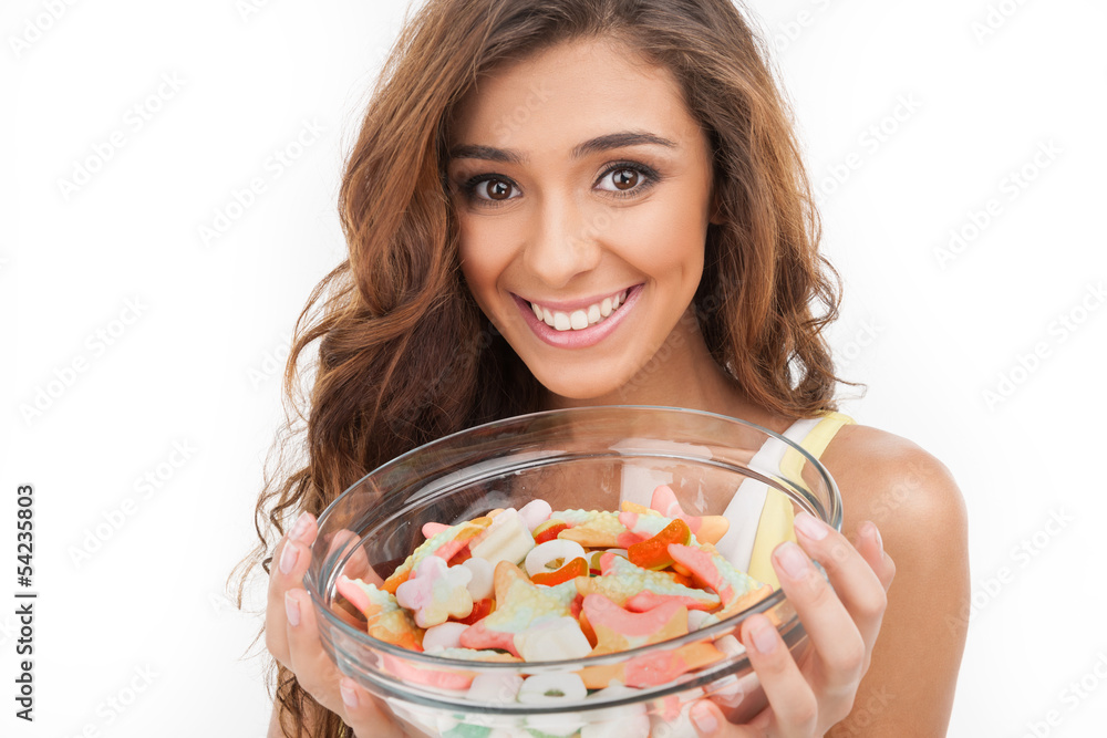 Sweet plate. Beautiful young women holding a plate full of candi Sweet plate. Beautiful young women holding a plate full of candi