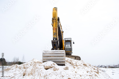excavator pile sand pit soil snow winter industry