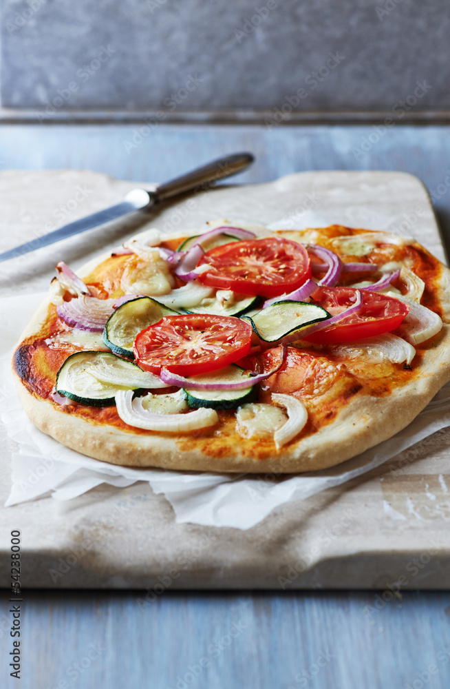 Vegetable pizza with zucchini, tomato and onion Vegetable pizza with zucchini, tomato and onion