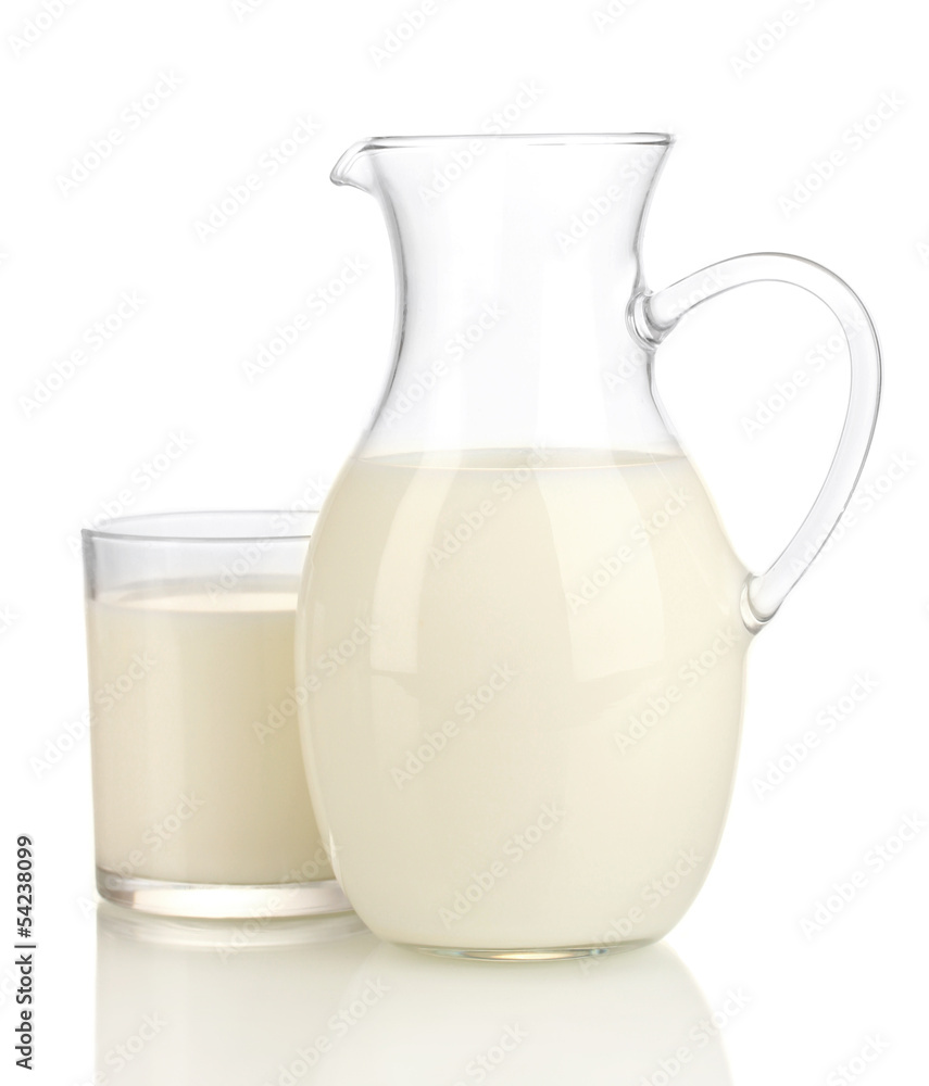 Milk in jug and glass isolated on white Milk in jug and glass isolated on white