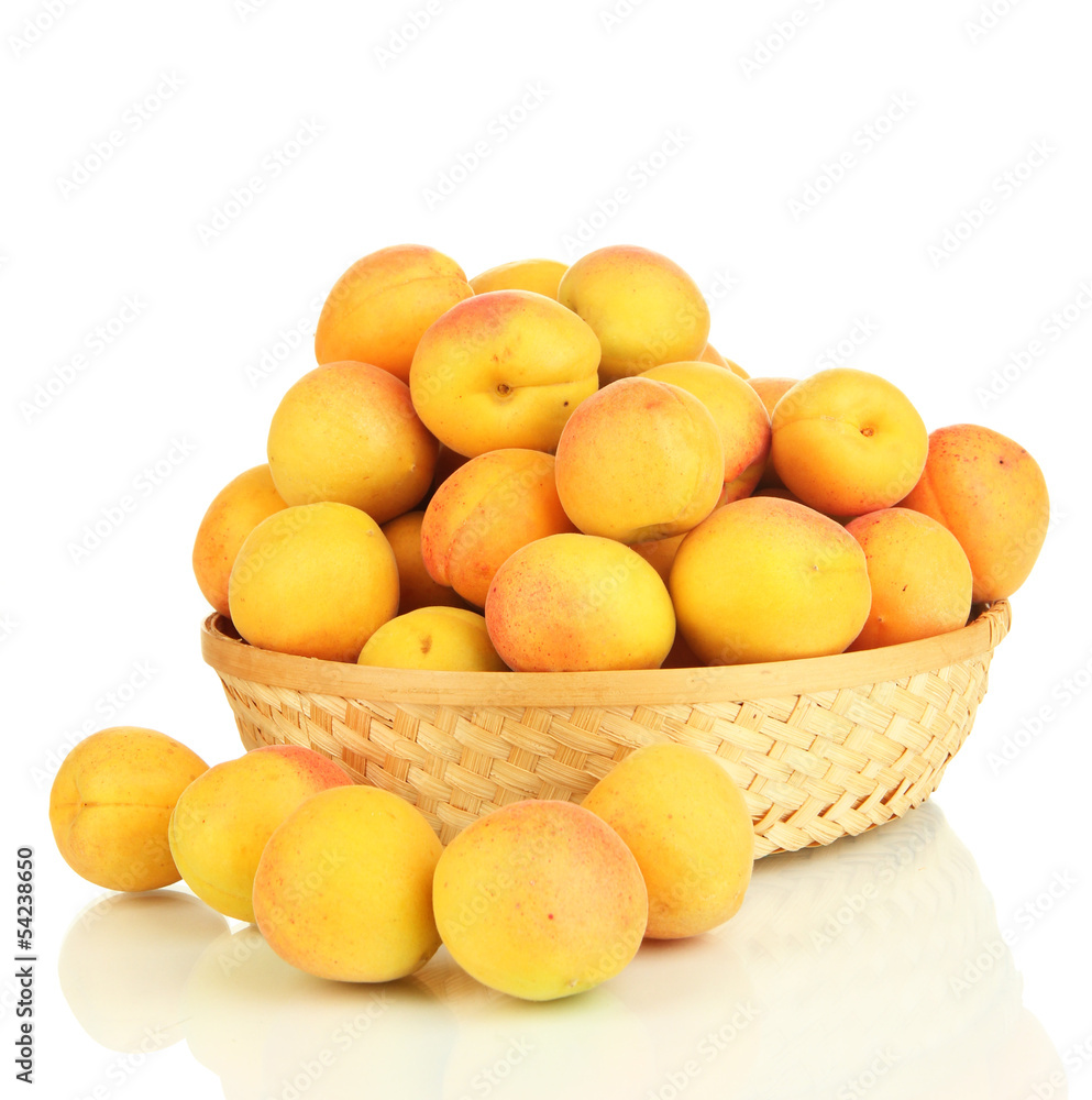 Fresh natural apricot in wicker basket isolated on white Fresh natural apricot in wicker basket isolated on white