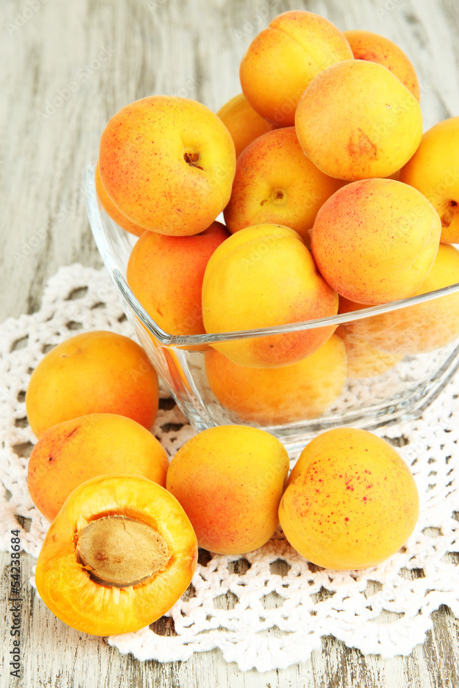 Fresh natural apricot in bowl on green wooden table Fresh natural apricot in bowl on green wooden table