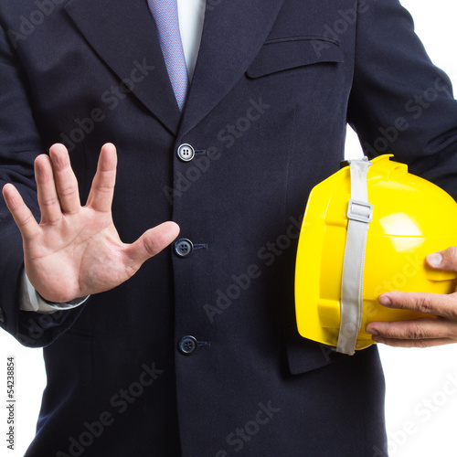engineer holding helmet on white background