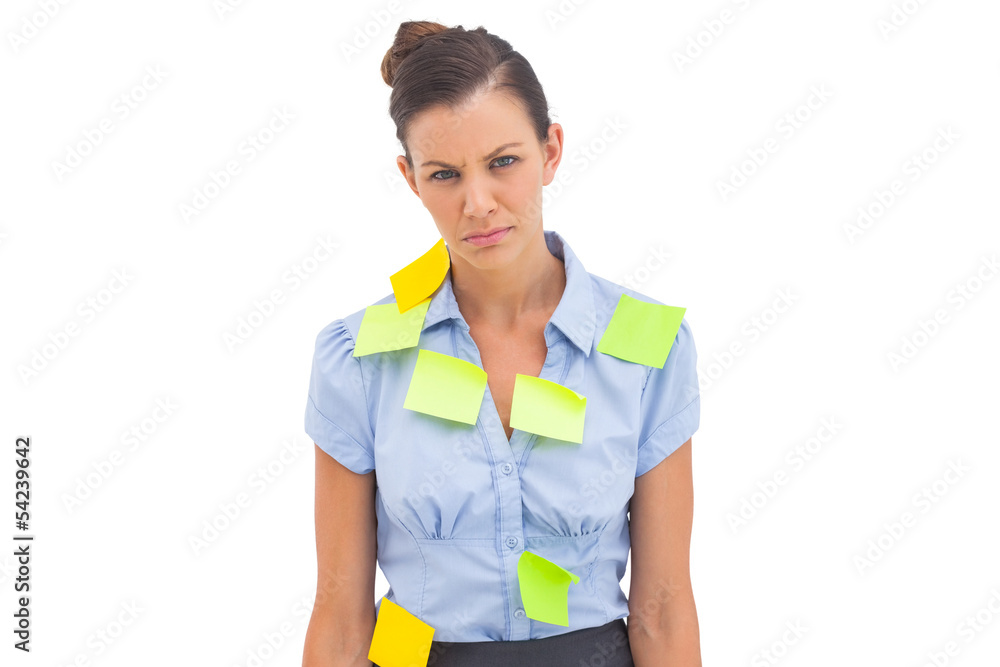 Upset businesswoman with adhesive notes Upset businesswoman with adhesive notes