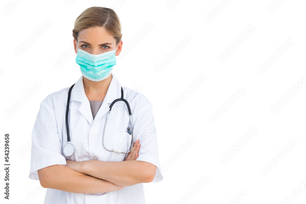 Nurse wearing protective mask with arms crossed Nurse wearing protective mask with arms crossed