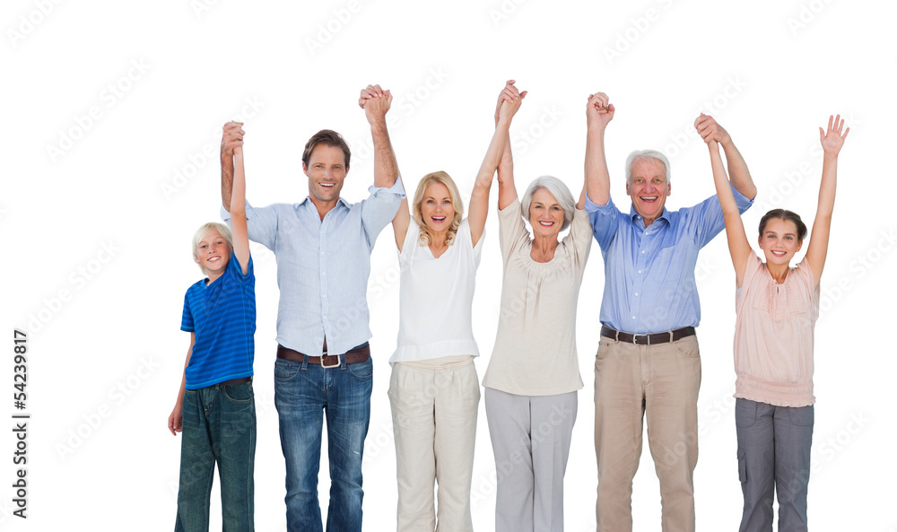 Smiling family raising their arms