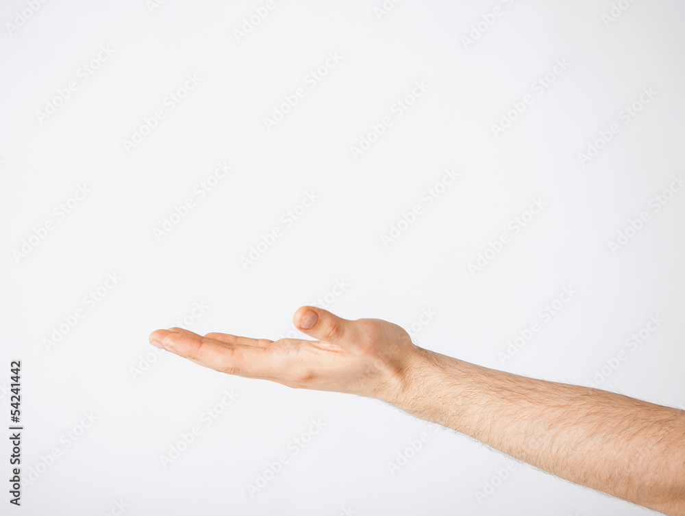 mans hand showing something mans hand showing something