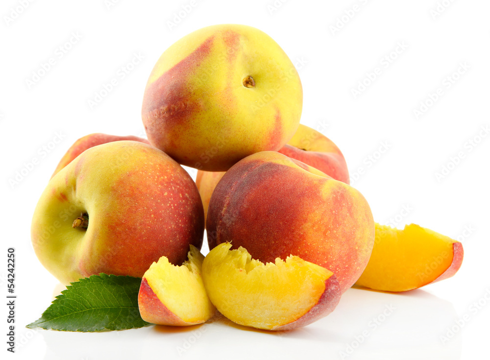 Ripe sweet peaches with leaves, isolated on white