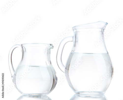 Glass pitchers of water isolated on white