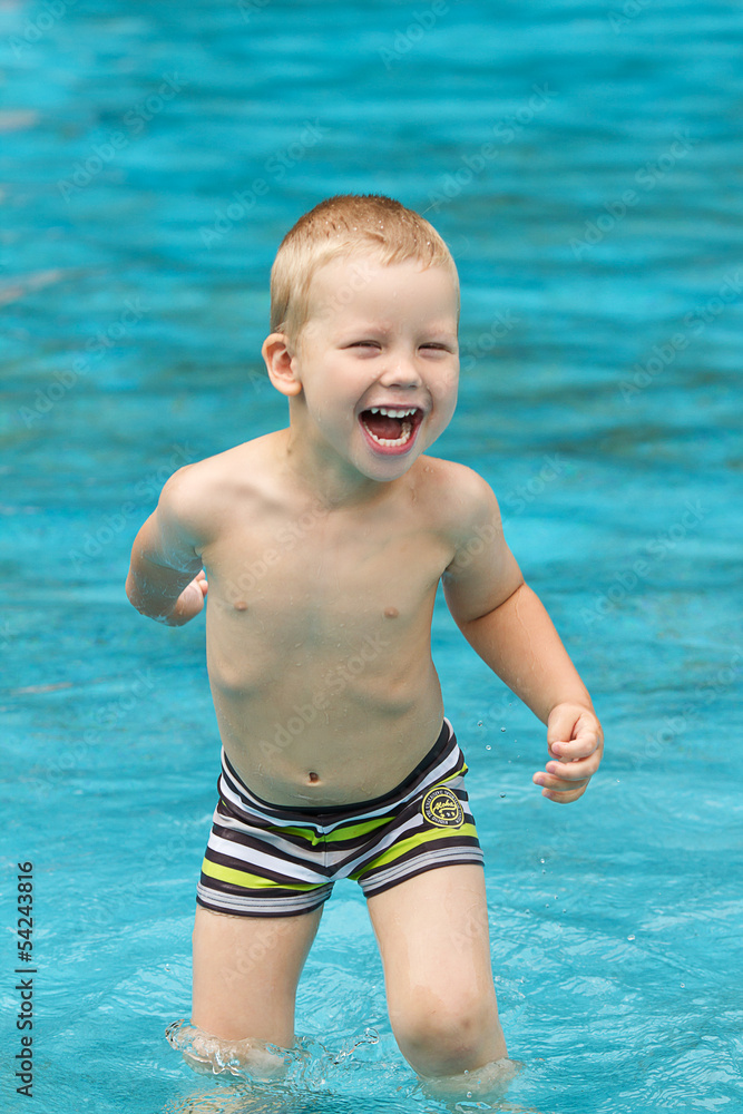 Three year old boy in swimming pool