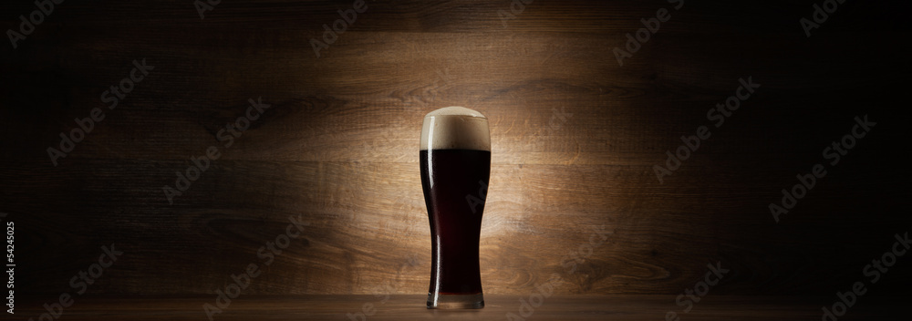 glass beer on wood background with copyspace
