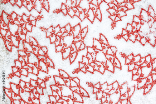 Abstract image of Christmas tree shapes in the snow. Close-up.