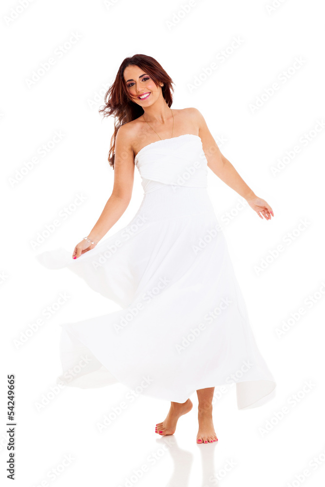 pretty young woman dancing on white