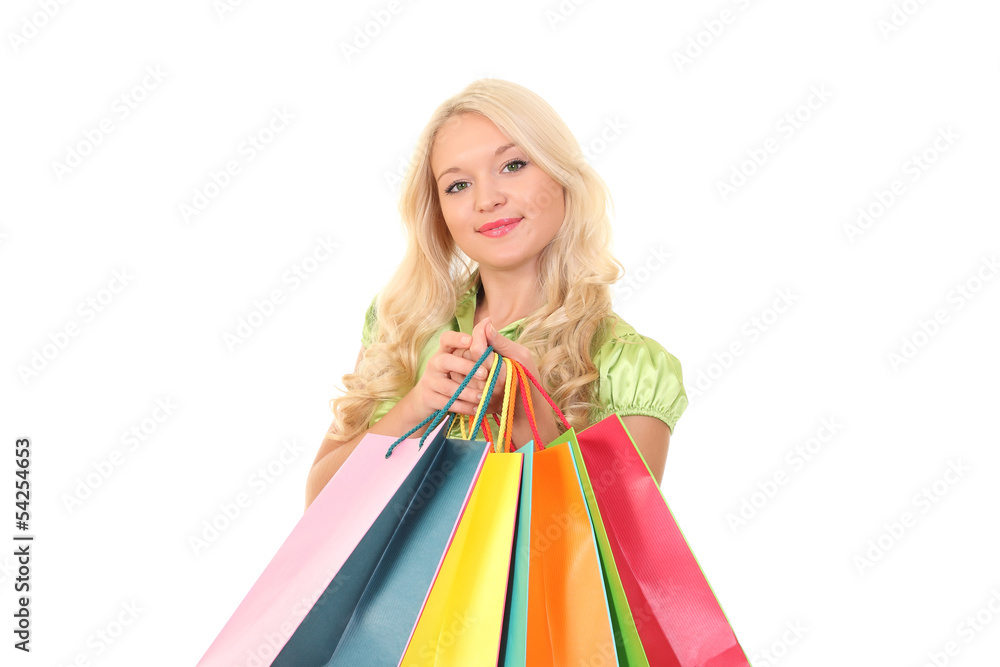 Attractive young female holding shopping bags isolated on white Attractive young female holding shopping bags isolated on white