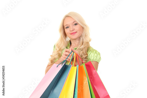 Attractive young female holding shopping bags isolated on white