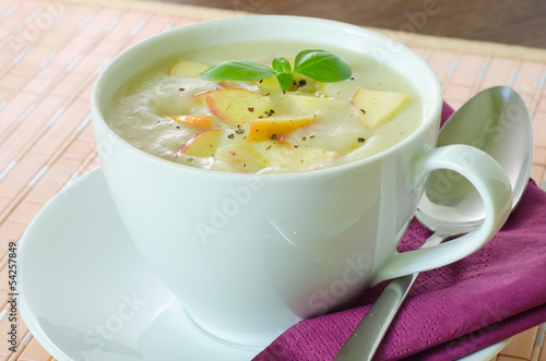 Closeup on a cup with potato and apple soup