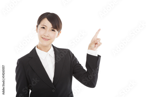 smiling business woman pointing to copy space