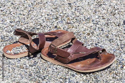 sandals on a rocky beach