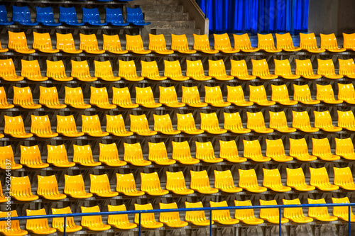 Wallpaper Mural Plenty of yellow and blue plastic seats at stadium . Torontodigital.ca