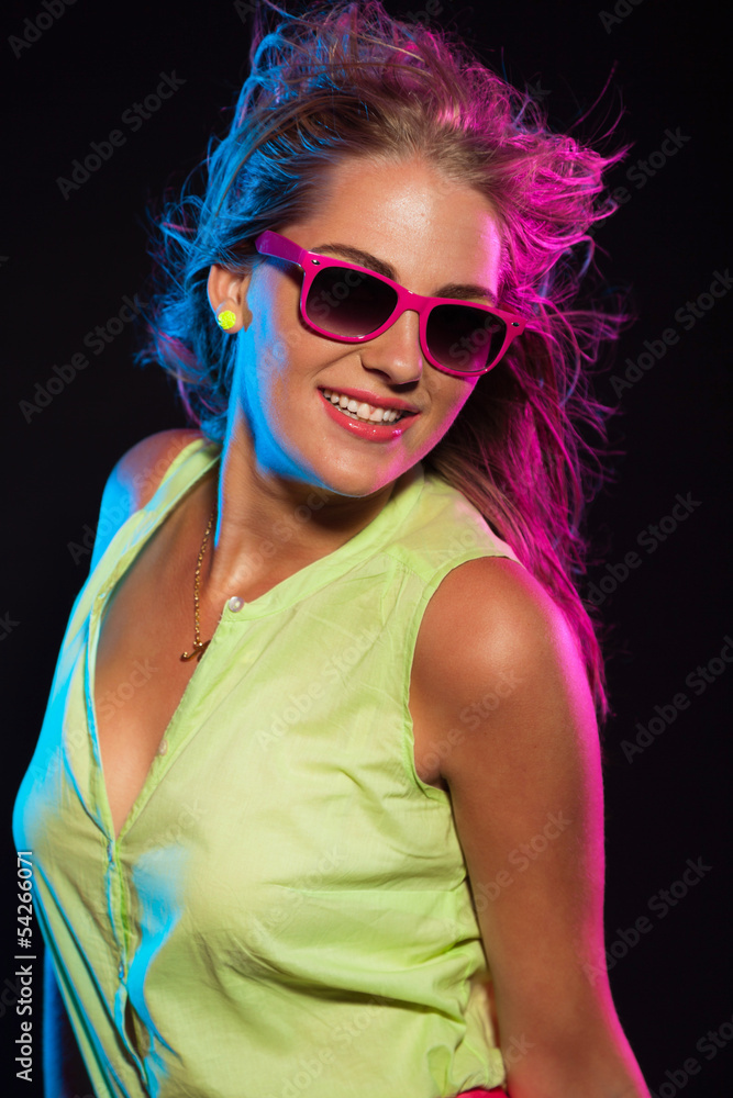 Sexy retro 80s fashion disco girl with long blonde hair and pink Sexy retro 80s fashion disco girl with long blonde hair and pink