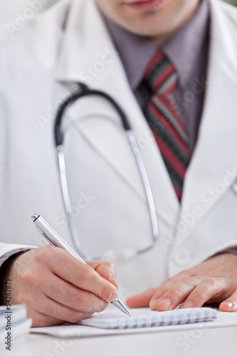 Doctor writing prescription