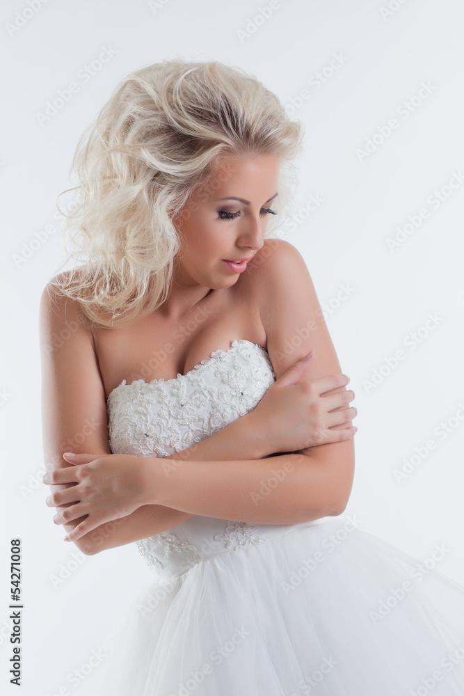 Shy beautiful bride posing in studio, close-up Shy beautiful bride posing in studio, close-up