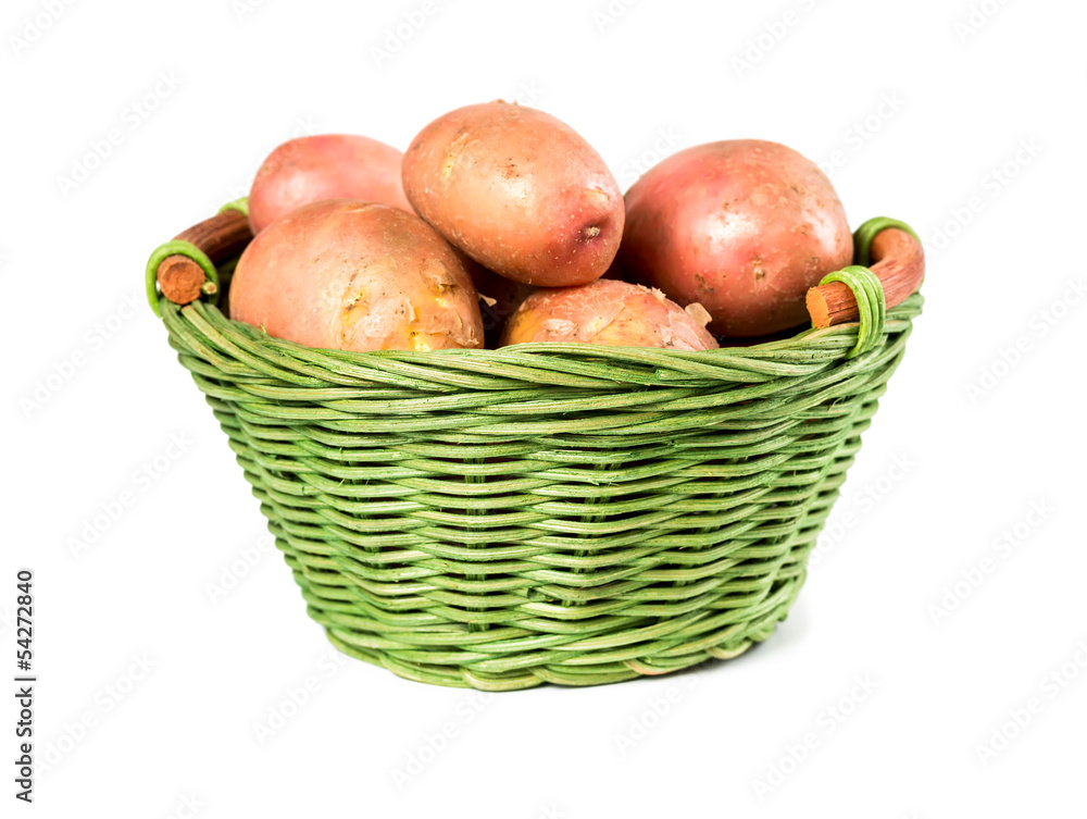 Raw potatoes in a wicker basket Raw potatoes in a wicker basket