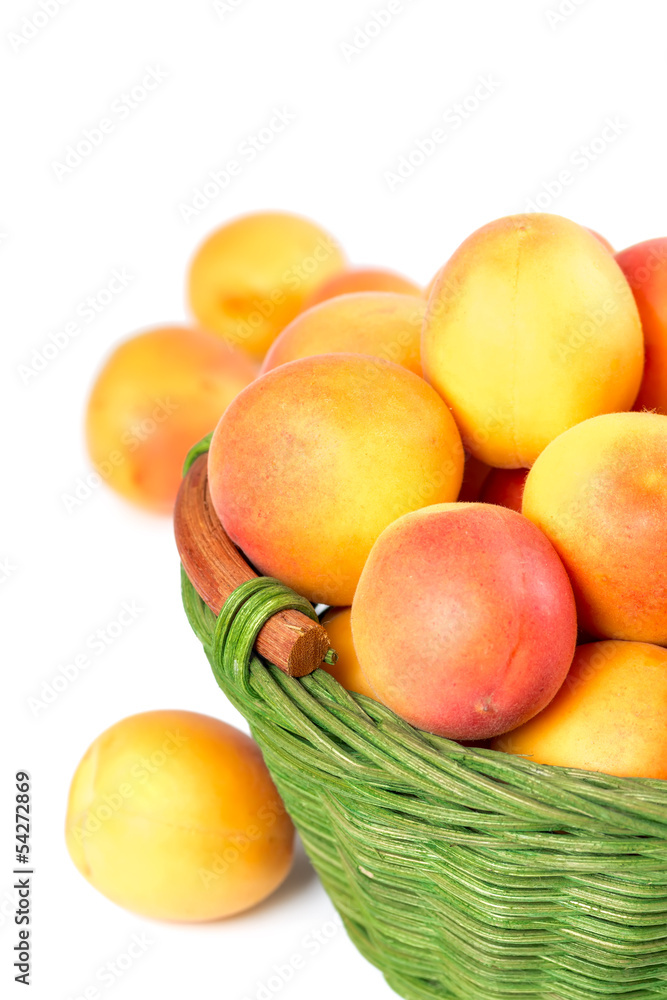 Ripe apricots in a wicker basket Ripe apricots in a wicker basket