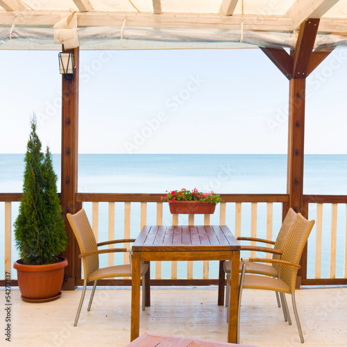 Outdoor restaurant at the beach © dziewul