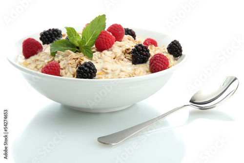 tasty oatmeal with berries, isolated on white