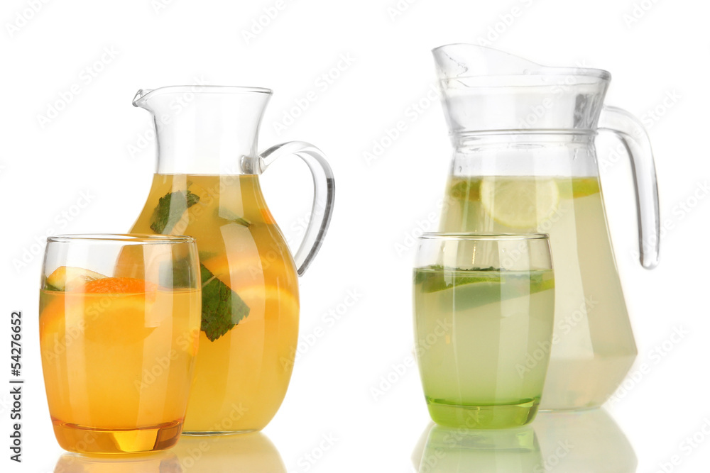 Orange and lemon lemonade in pitchers and glasses isolated Orange and lemon lemonade in pitchers and glasses isolated