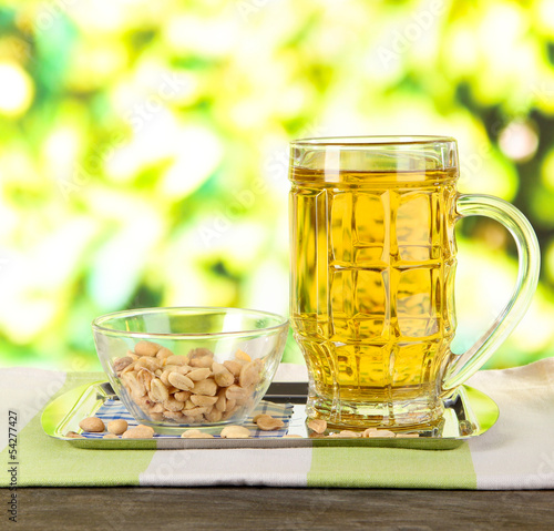 Beer in glass and nuts