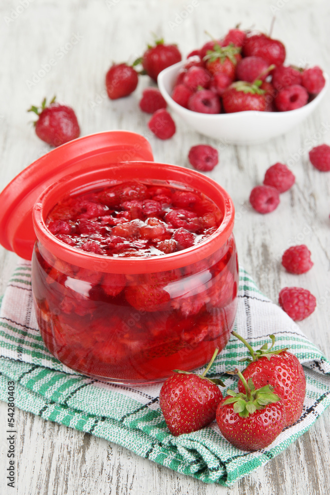 Home made berry jam on wooden table Home made berry jam on wooden table