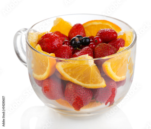 Useful fruit salad in glass cup isolated on white