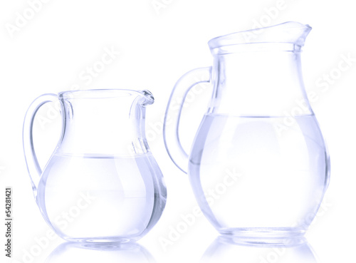 Glass pitchers of water isolated on white