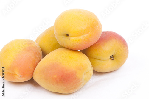 Apricots on white background