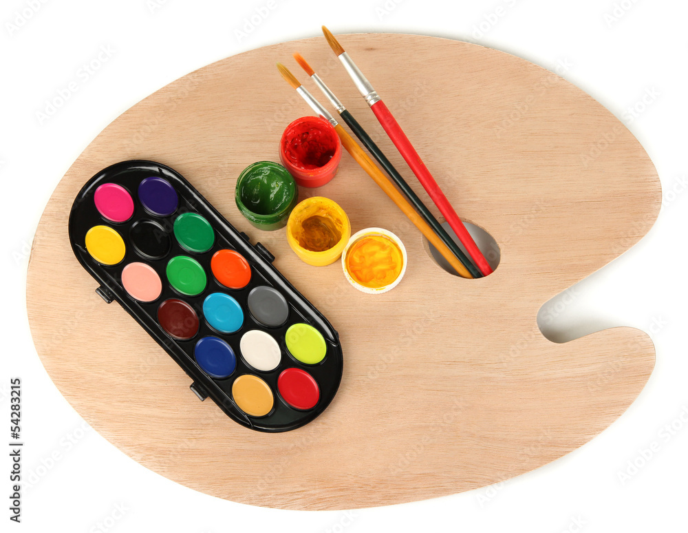 Wooden art palette with brushes for painting and paints Wooden art palette with brushes for painting and paints
