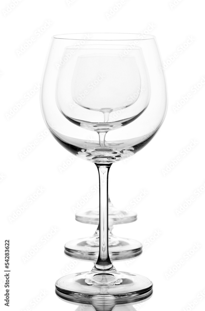 Empty wine glasses arranged and isolated on white