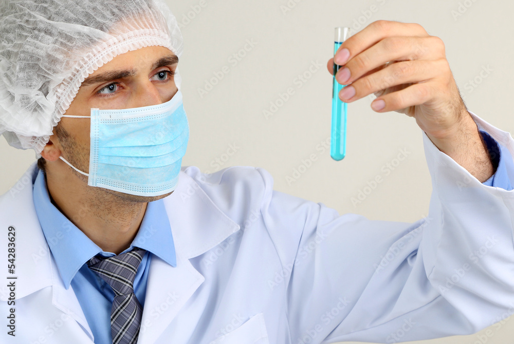 Young laboratory scientist working at lab Young laboratory scientist working at lab