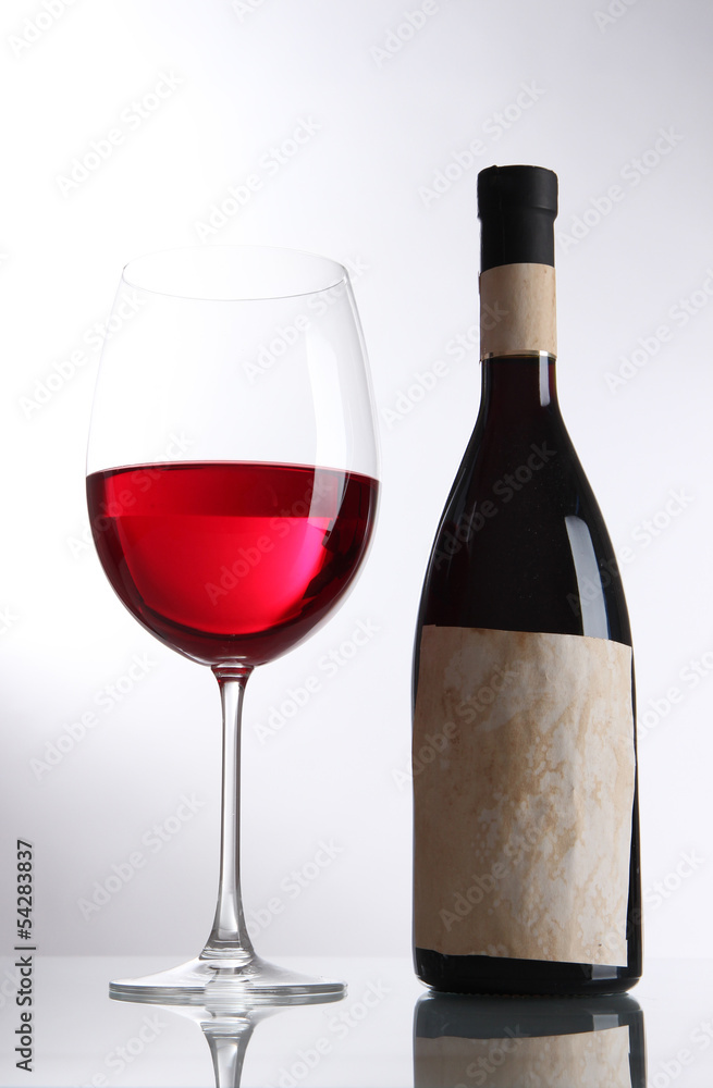 Glass of wine with bottle isolated on white Glass of wine with bottle isolated on white