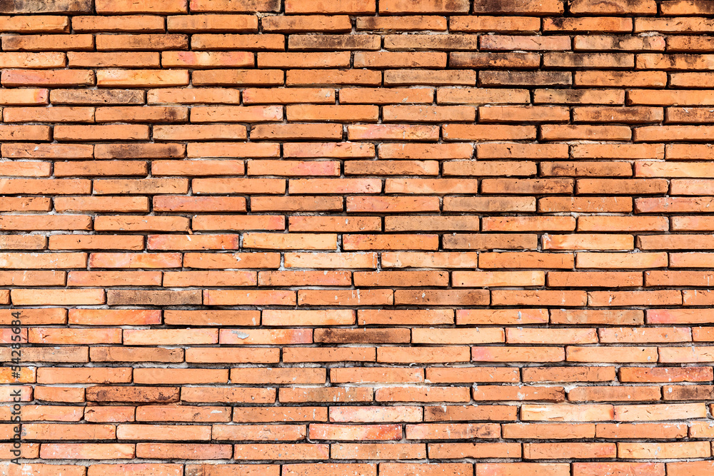 Obraz premium Old orange brown brick wall